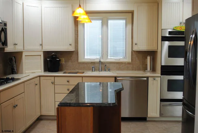 a kitchen with a sink and a cabinets
