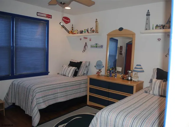 a bedroom with bed and window