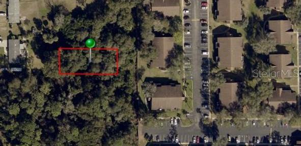 2nd Street DeLand, FL 32720 - Photo 24 of 28 an aerial view of a house with a yard and large trees