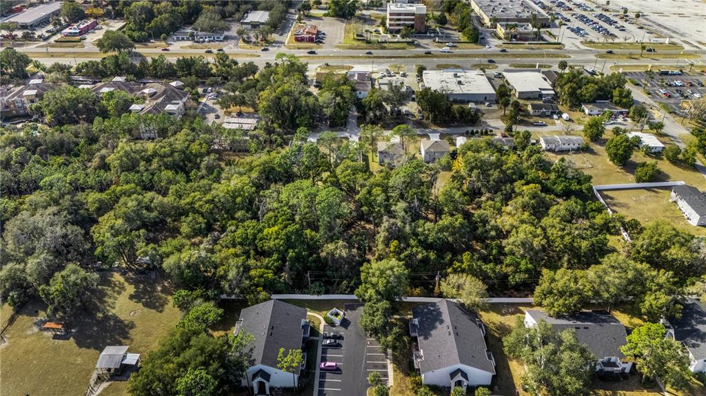 2nd Street DeLand, FL 32720 - Photo 7 of 28 an aerial view of residential house with parking space and trees