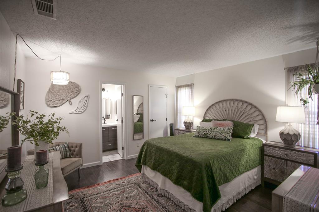 1720 Crystal Way Plano, TX 75074 - Photo 16 of 32 a bedroom with a bed a mirror and a potted plant