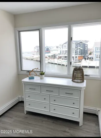 a view of room with window and furniture