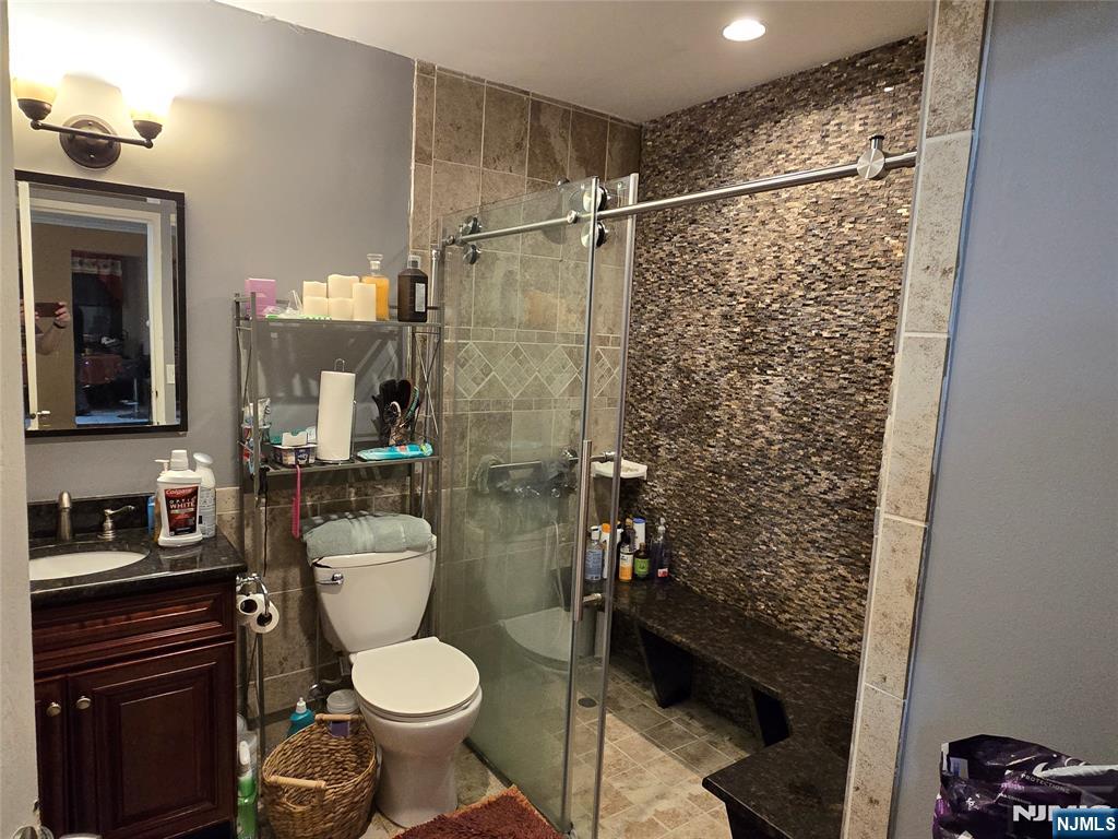 326 Prospect Avenue, Unit 1A Hackensack, NJ 07601 - Photo 14 of 19 a bathroom with a toilet and a shower