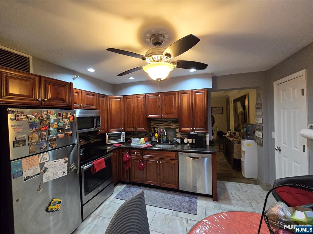 326 Prospect Avenue, Unit 1A Hackensack, NJ 07601 - Photo 8 of 19 a kitchen with lots of counter space and appliances