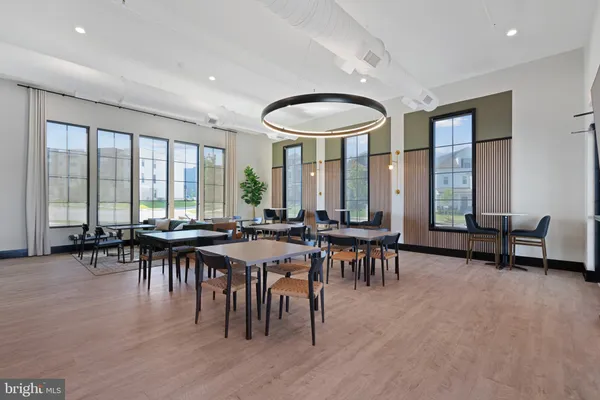 a kitchen with stainless steel appliances a refrigerator and a stove top oven