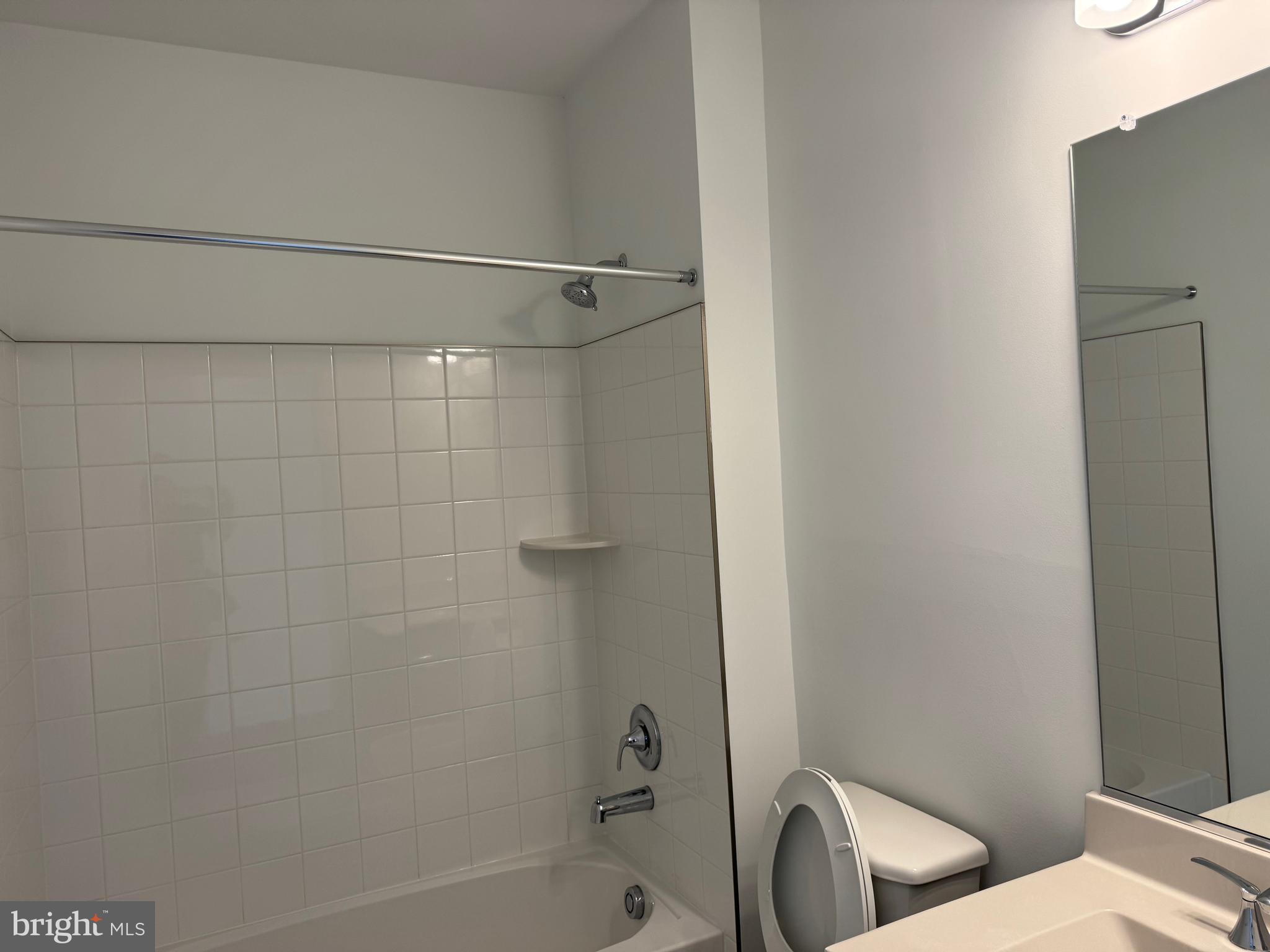 21731 Dovekie Terrace, Unit 408 Ashburn, VA 20147 - Photo 12 of 20 a bathroom with a toilet and shower