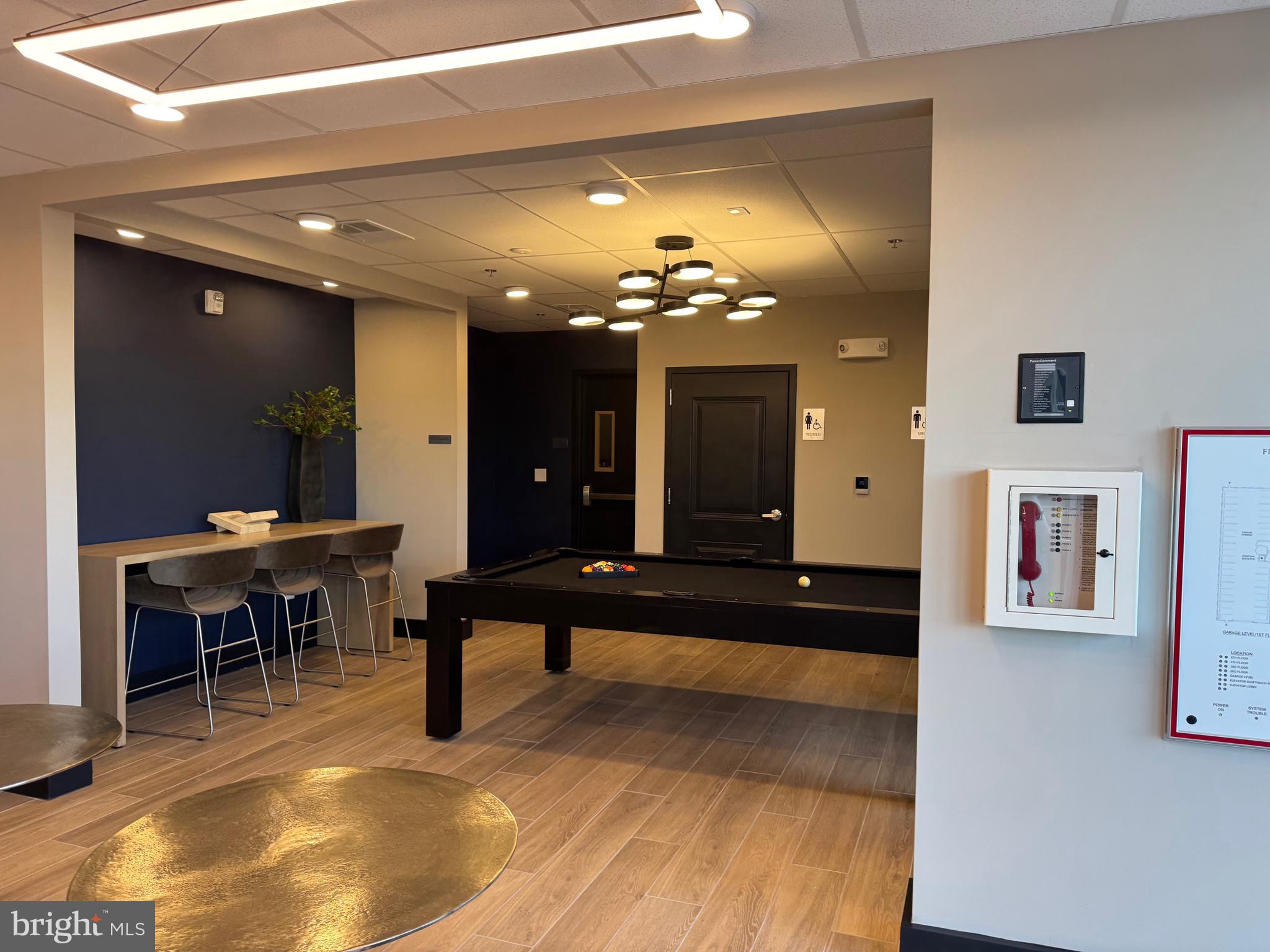 21731 Dovekie Terrace, Unit 408 Ashburn, VA 20147 - Photo 18 of 20 a view of a lobby area with furniture and chandelier
