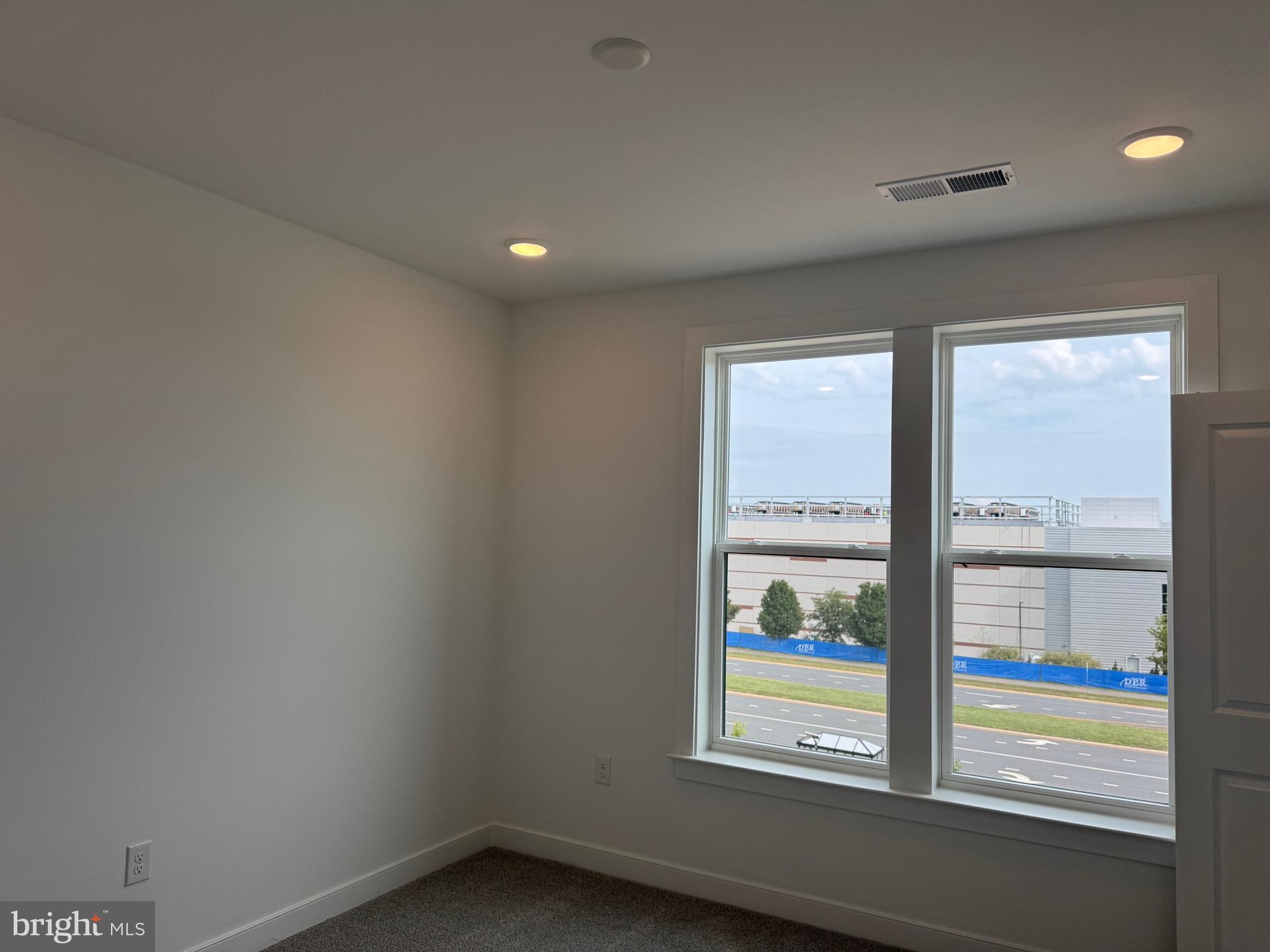 21731 Dovekie Terrace, Unit 408 Ashburn, VA 20147 - Photo 9 of 20 an empty room with window