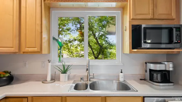 a view of a dining room with furniture window and outside view