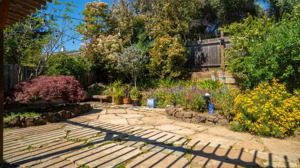 a view of a backyard of the house