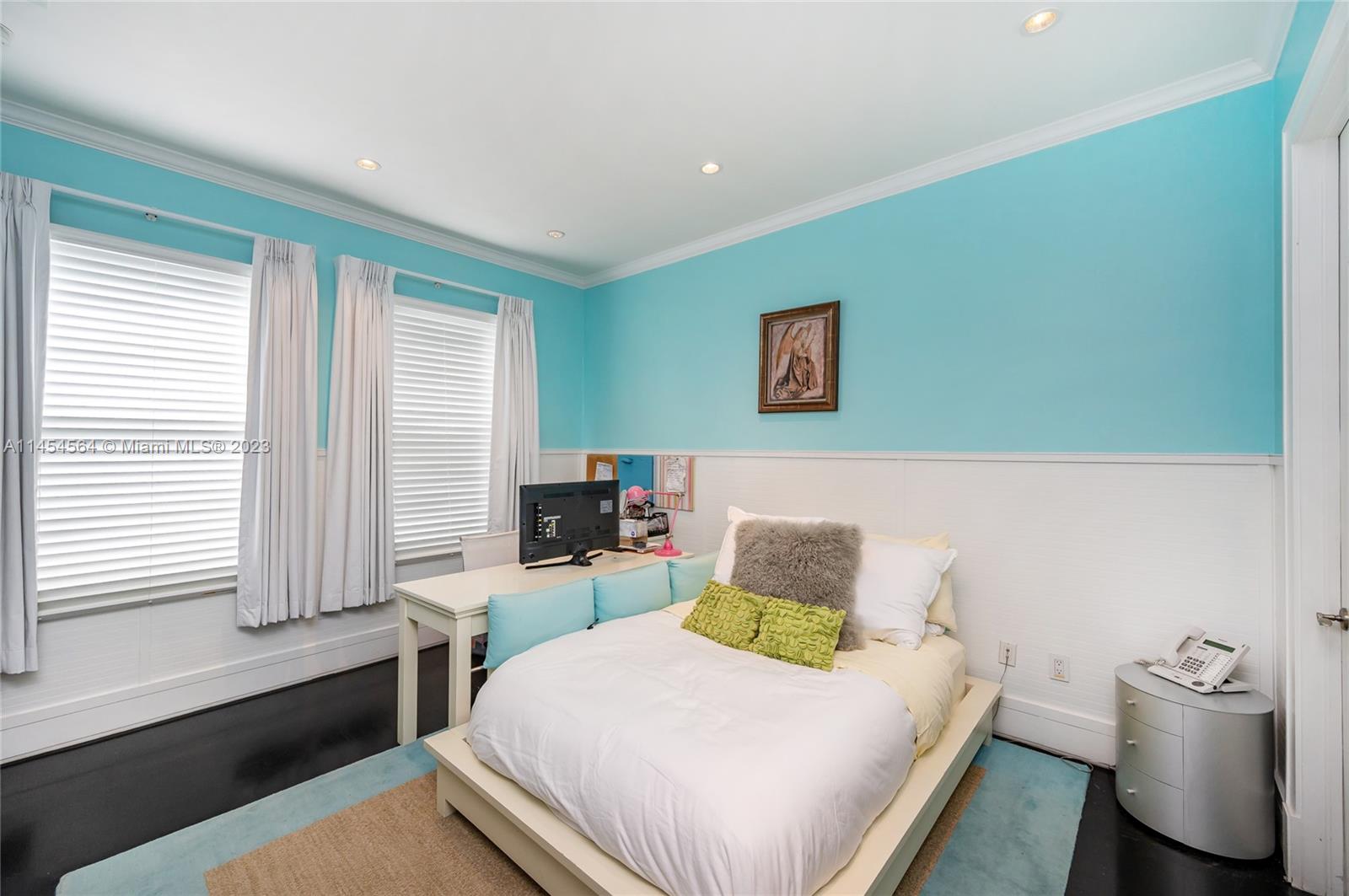 8325 School House Road Miami, FL 33143 - Photo 12 of 21 a bedroom with a bed and wooden floor