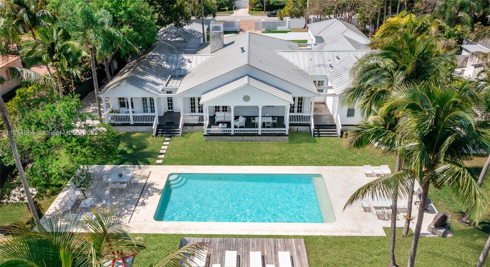 8325 School House Road Miami, FL 33143 - Photo 15 of 21 a view of a house with a swimming pool