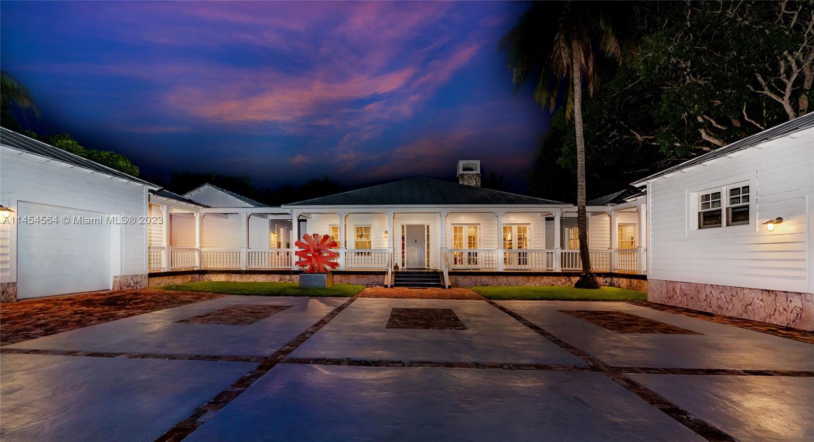 8325 School House Road Miami, FL 33143 - Photo 17 of 21 a front view of a house with a yard