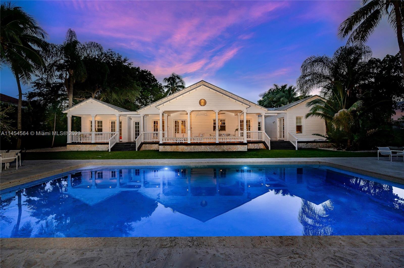 8325 School House Road Miami, FL 33143 - Photo 3 of 21 a front view of a house with swimming pool