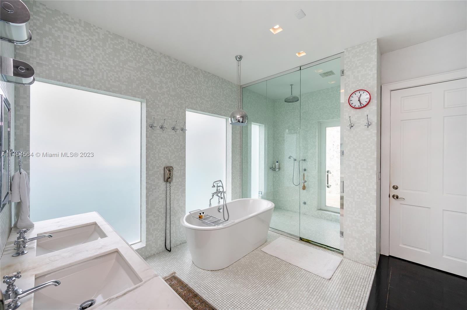 8325 School House Road Miami, FL 33143 - Photo 9 of 21 a bathroom with a double vanity sink toilet and shower