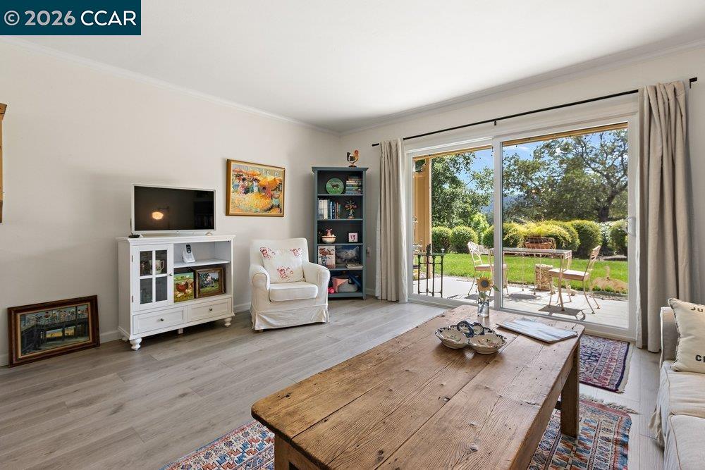 2001 Golden Rain Road, Unit 4 Walnut Creek, CA 94595 - Photo 11 of 60 a living room with furniture and a flat screen tv