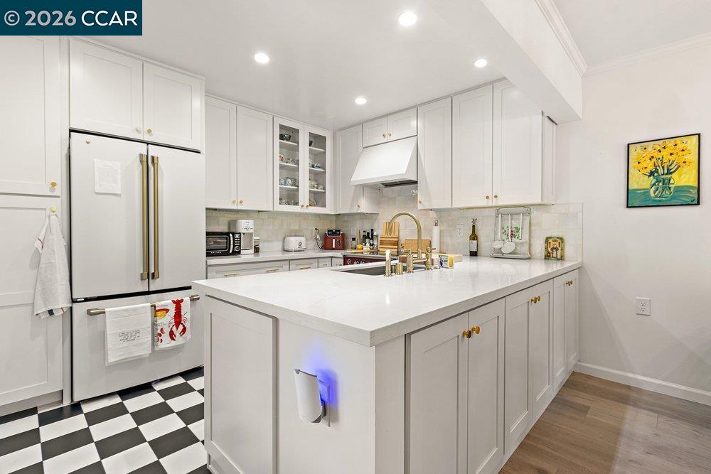 2001 Golden Rain Road, Unit 4 Walnut Creek, CA 94595 - Photo 14 of 60 a kitchen with a sink a refrigerator and cabinets