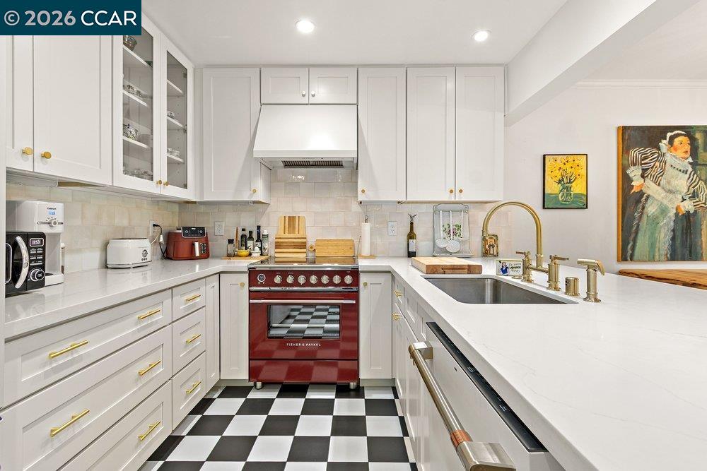 2001 Golden Rain Road, Unit 4 Walnut Creek, CA 94595 - Photo 15 of 60 a kitchen with a sink a stove and cabinets