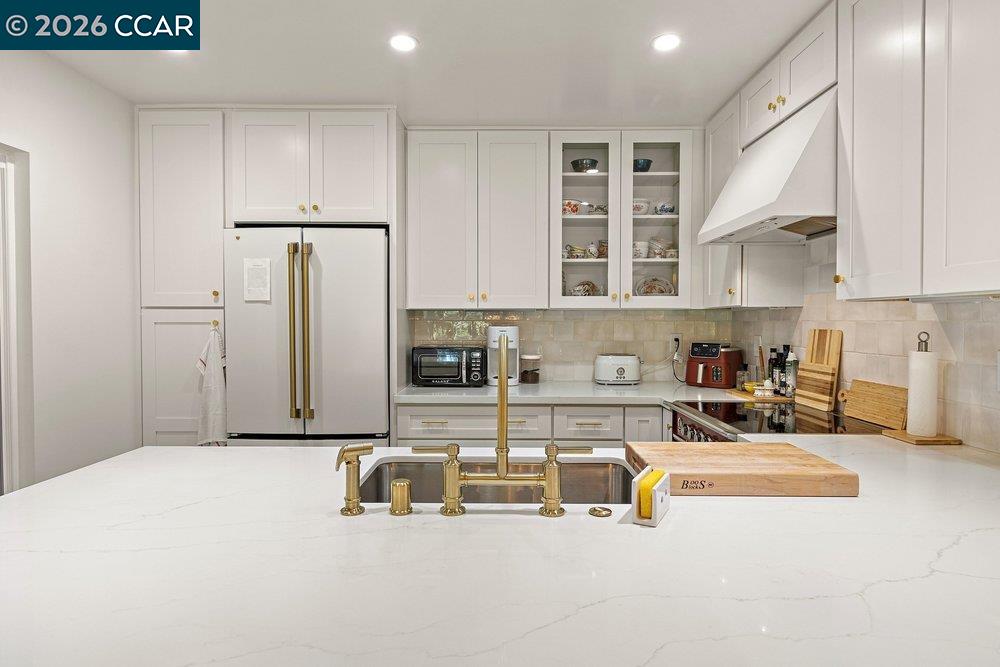 2001 Golden Rain Road, Unit 4 Walnut Creek, CA 94595 - Photo 16 of 60 a kitchen with stainless steel appliances a sink a stove and a refrigerator