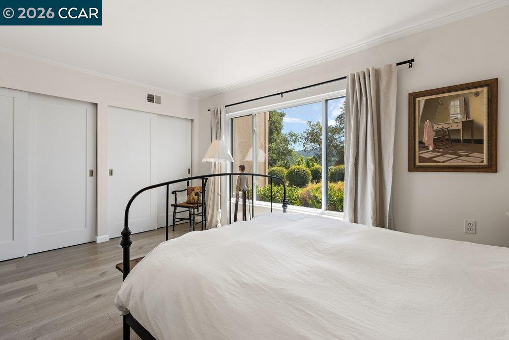 2001 Golden Rain Road, Unit 4 Walnut Creek, CA 94595 - Photo 18 of 60 a bed sitting in a bedroom next to a window