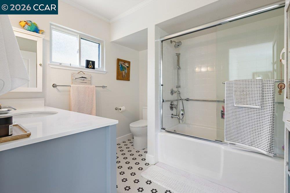 2001 Golden Rain Road, Unit 4 Walnut Creek, CA 94595 - Photo 20 of 60 a bathroom with a sink a mirror and a shower