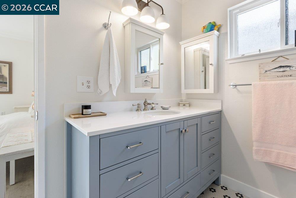 2001 Golden Rain Road, Unit 4 Walnut Creek, CA 94595 - Photo 21 of 60 a bathroom with a sink a mirror and a vanity