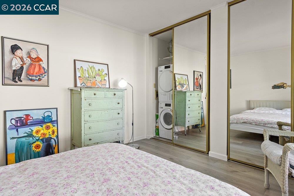 2001 Golden Rain Road, Unit 4 Walnut Creek, CA 94595 - Photo 24 of 60 a bedroom with a bed and painting on the wall