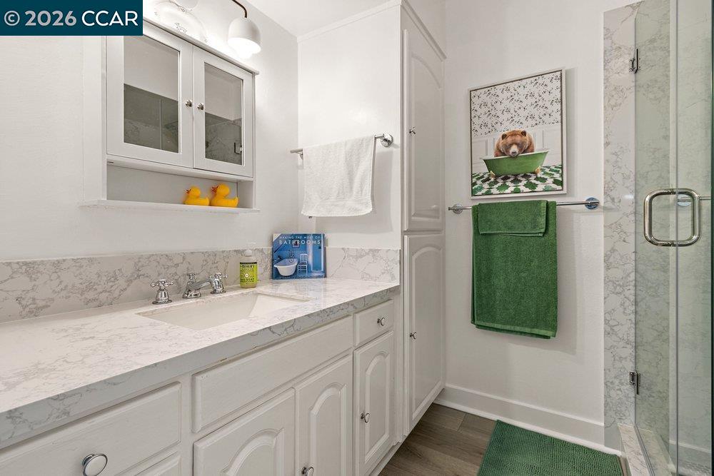 2001 Golden Rain Road, Unit 4 Walnut Creek, CA 94595 - Photo 26 of 60 a bathroom with a sink and a mirror
