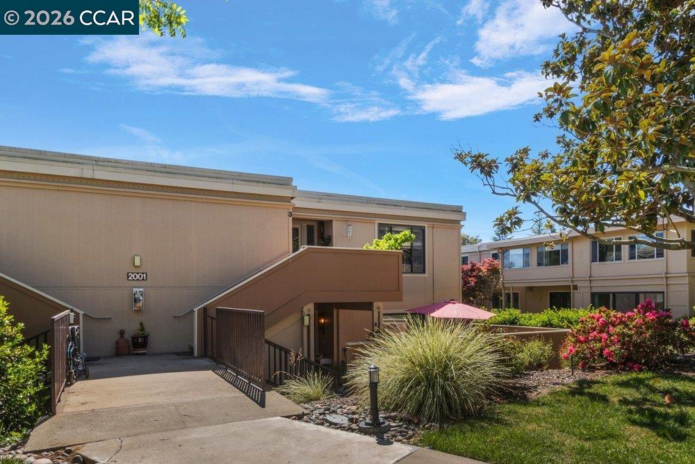 2001 Golden Rain Road, Unit 4 Walnut Creek, CA 94595 - Photo 3 of 60 a front view of house with yard and trees around