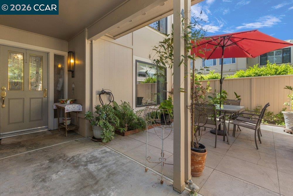 2001 Golden Rain Road, Unit 4 Walnut Creek, CA 94595 - Photo 4 of 60 a view of a patio with chairs and table under an umbrella
