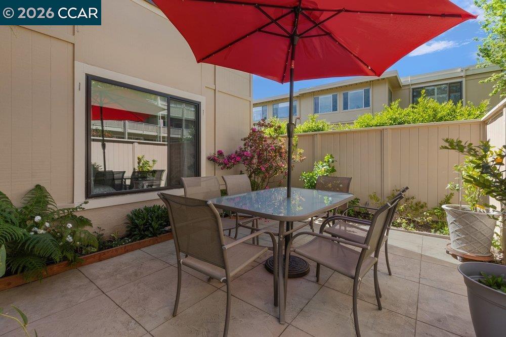 2001 Golden Rain Road, Unit 4 Walnut Creek, CA 94595 - Photo 5 of 60 a view of a patio with table and chairs under an umbrella