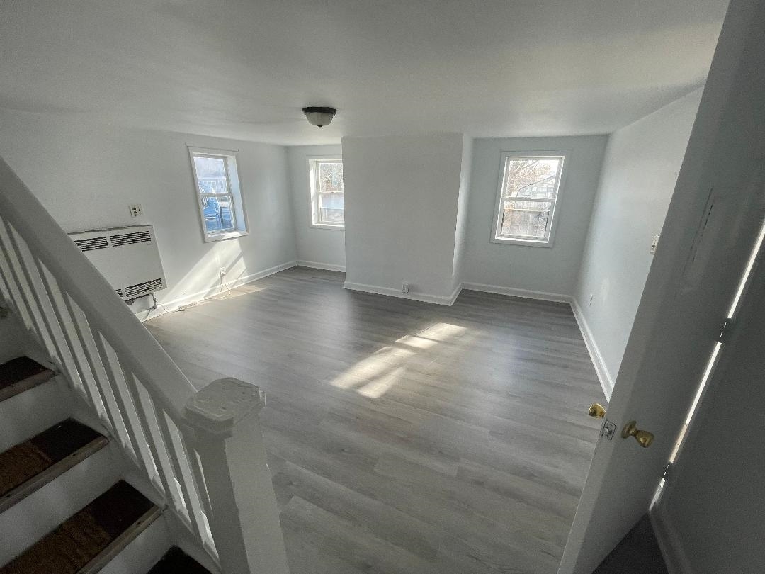 597 Seashore Road Erma, NJ 08204 - Photo 16 of 31 a view of an empty room with wooden floor and windows
