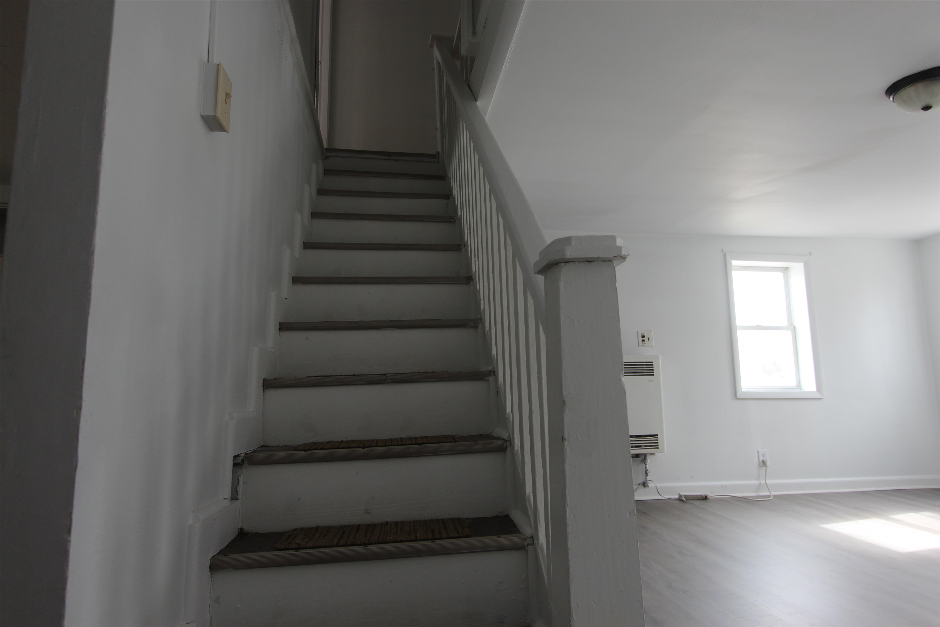 597 Seashore Road Erma, NJ 08204 - Photo 17 of 31 a view of entryway with stairs and wooden floor