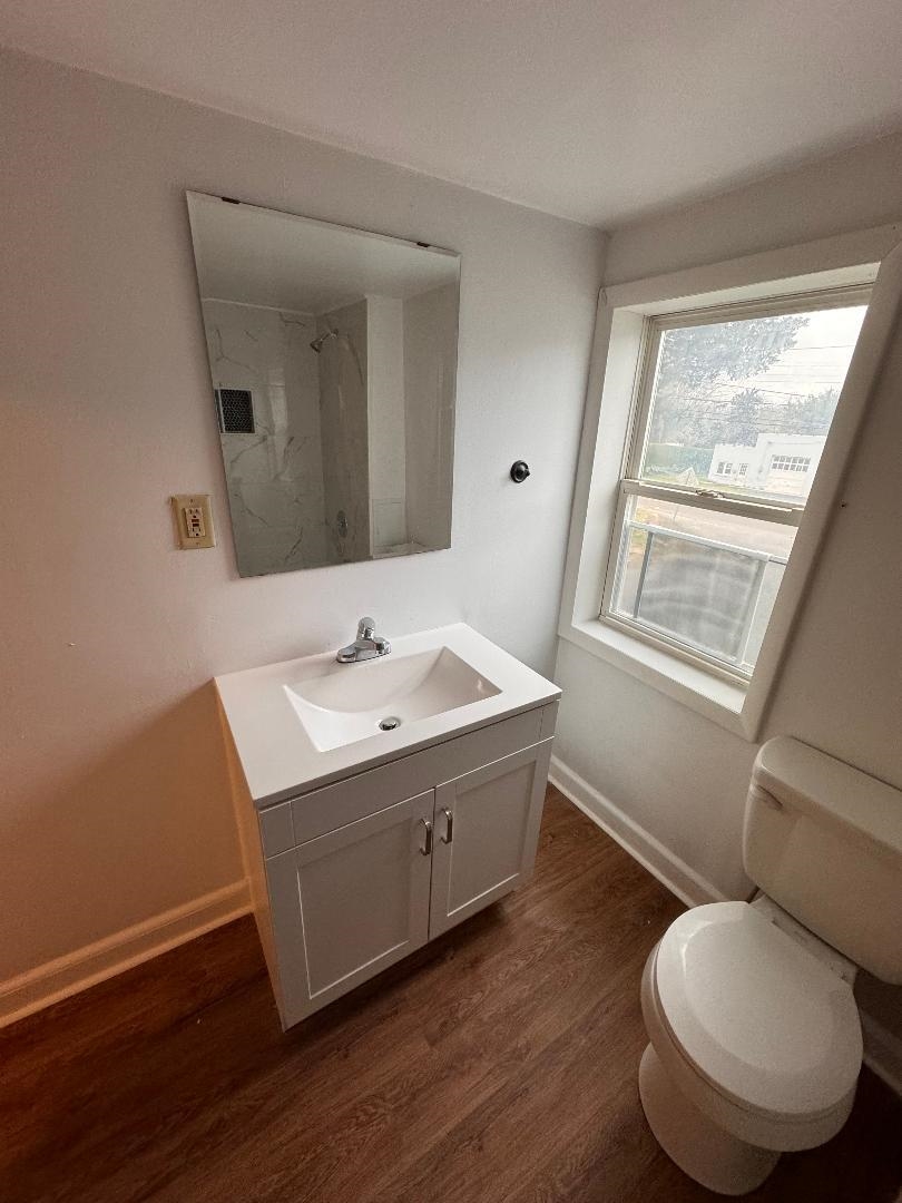 597 Seashore Road Erma, NJ 08204 - Photo 19 of 31 a bathroom with a toilet sink and mirror