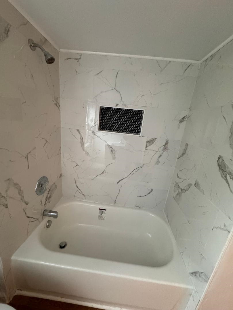 597 Seashore Road Erma, NJ 08204 - Photo 20 of 31 a bathroom with a bathtub