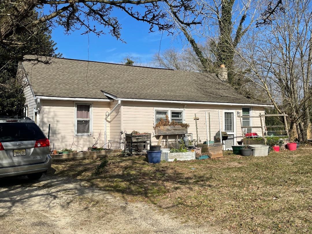 597 Seashore Road Erma, NJ 08204 - Photo 2 of 31 a view of a house with a patio and a fire pit