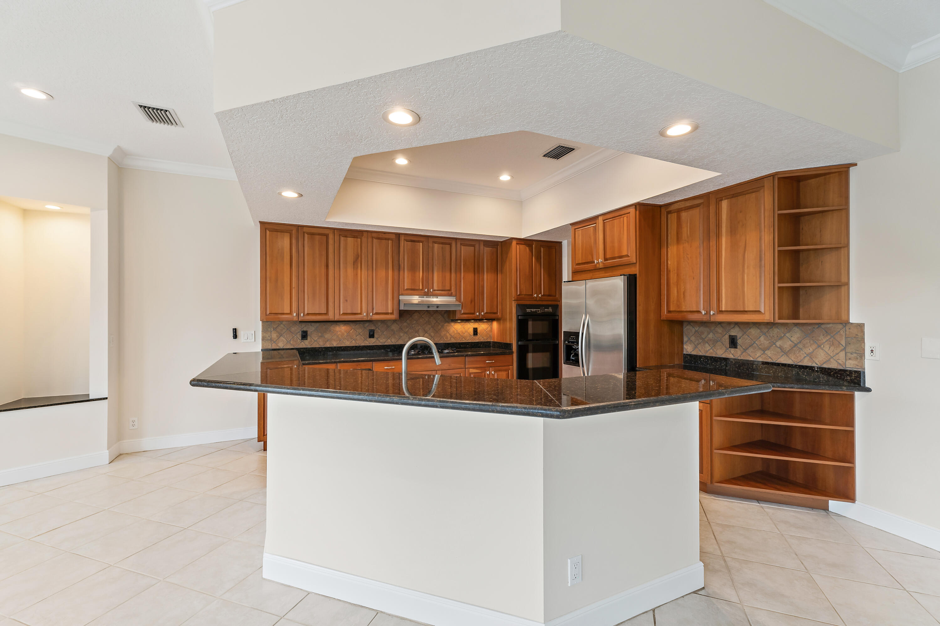 111 Fishermans Way Jupiter, FL 33477 - Photo 16 of 57 a kitchen with stainless steel appliances granite countertop a sink and cabinets