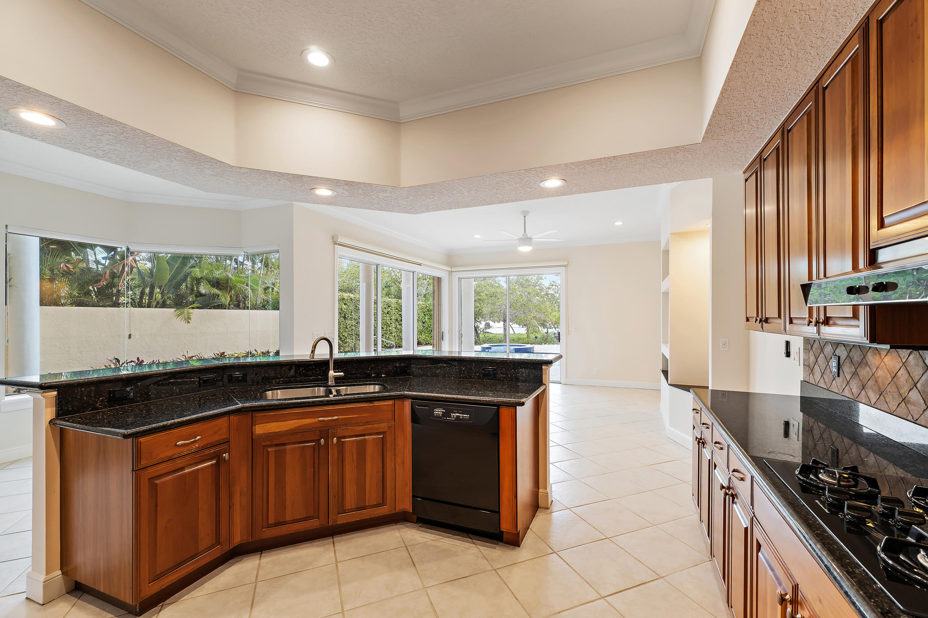 111 Fishermans Way Jupiter, FL 33477 - Photo 18 of 57 a kitchen with a sink and cabinets