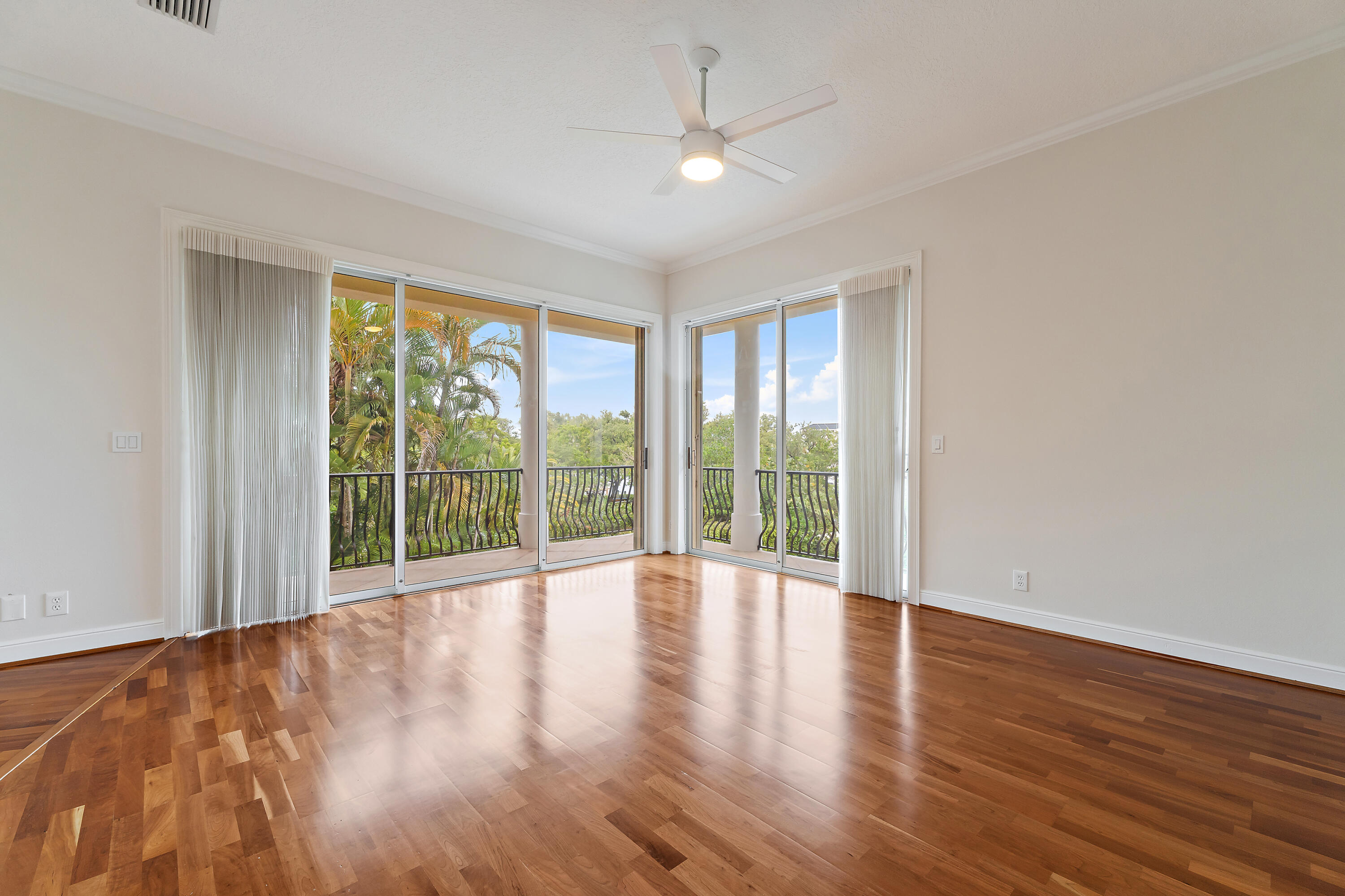 111 Fishermans Way Jupiter, FL 33477 - Photo 31 of 57 a view of an empty room with wooden floor and a window