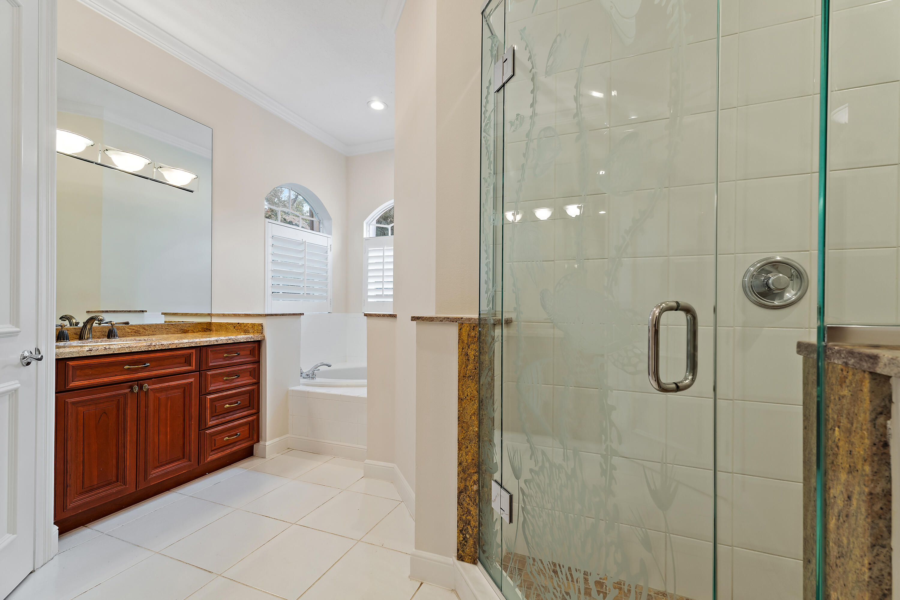 111 Fishermans Way Jupiter, FL 33477 - Photo 32 of 57 a bathroom with a granite countertop shower sink and mirror