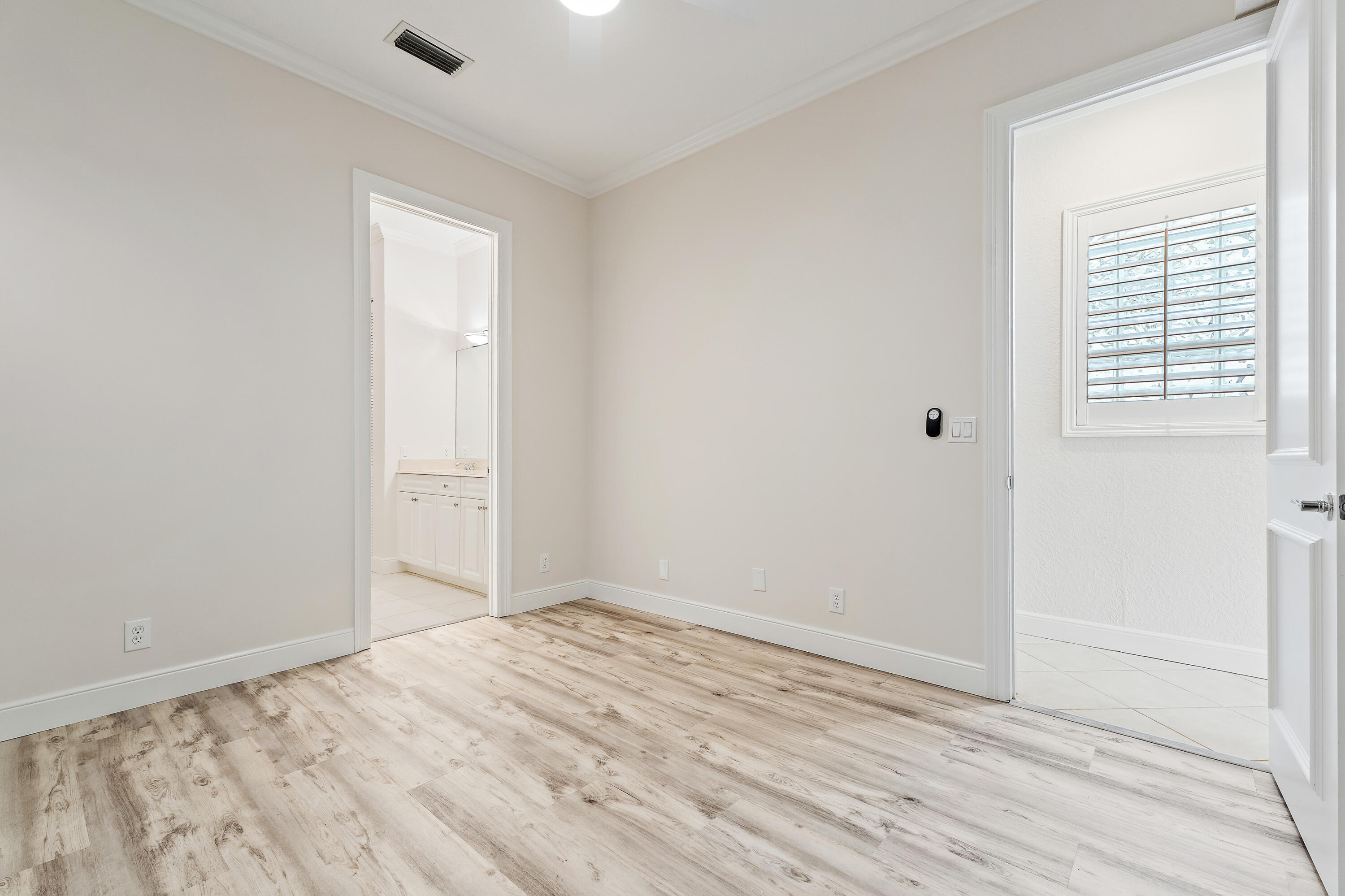 111 Fishermans Way Jupiter, FL 33477 - Photo 37 of 57 wooden floor in an empty room with a window