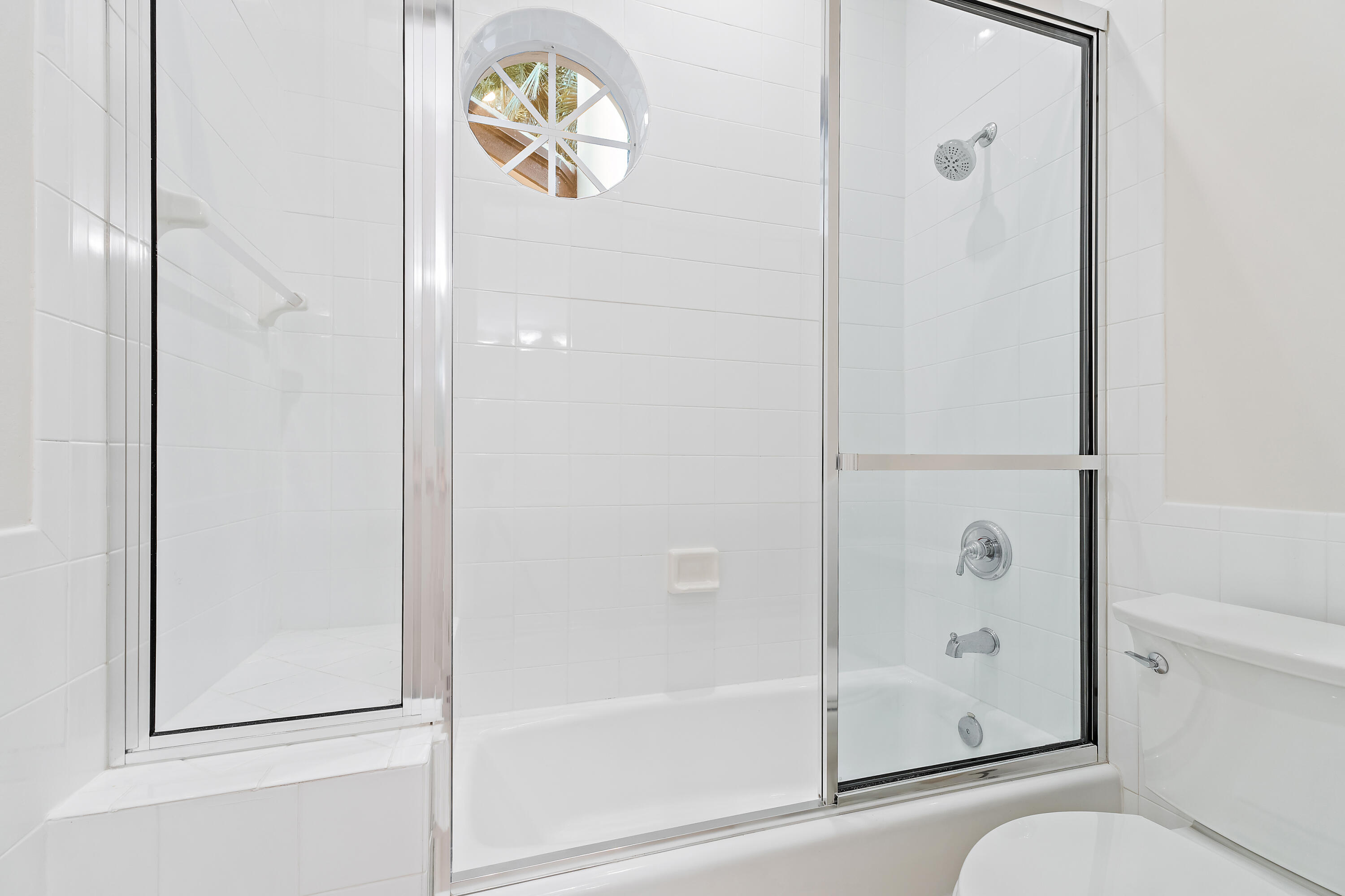 111 Fishermans Way Jupiter, FL 33477 - Photo 39 of 57 a bathroom with a glass shower door