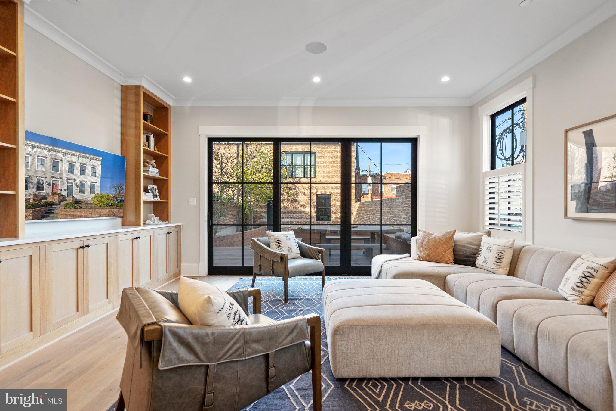 214 A Street Northeast Washington, DC 20002 - Photo 17 of 78 a living room with furniture and a large window