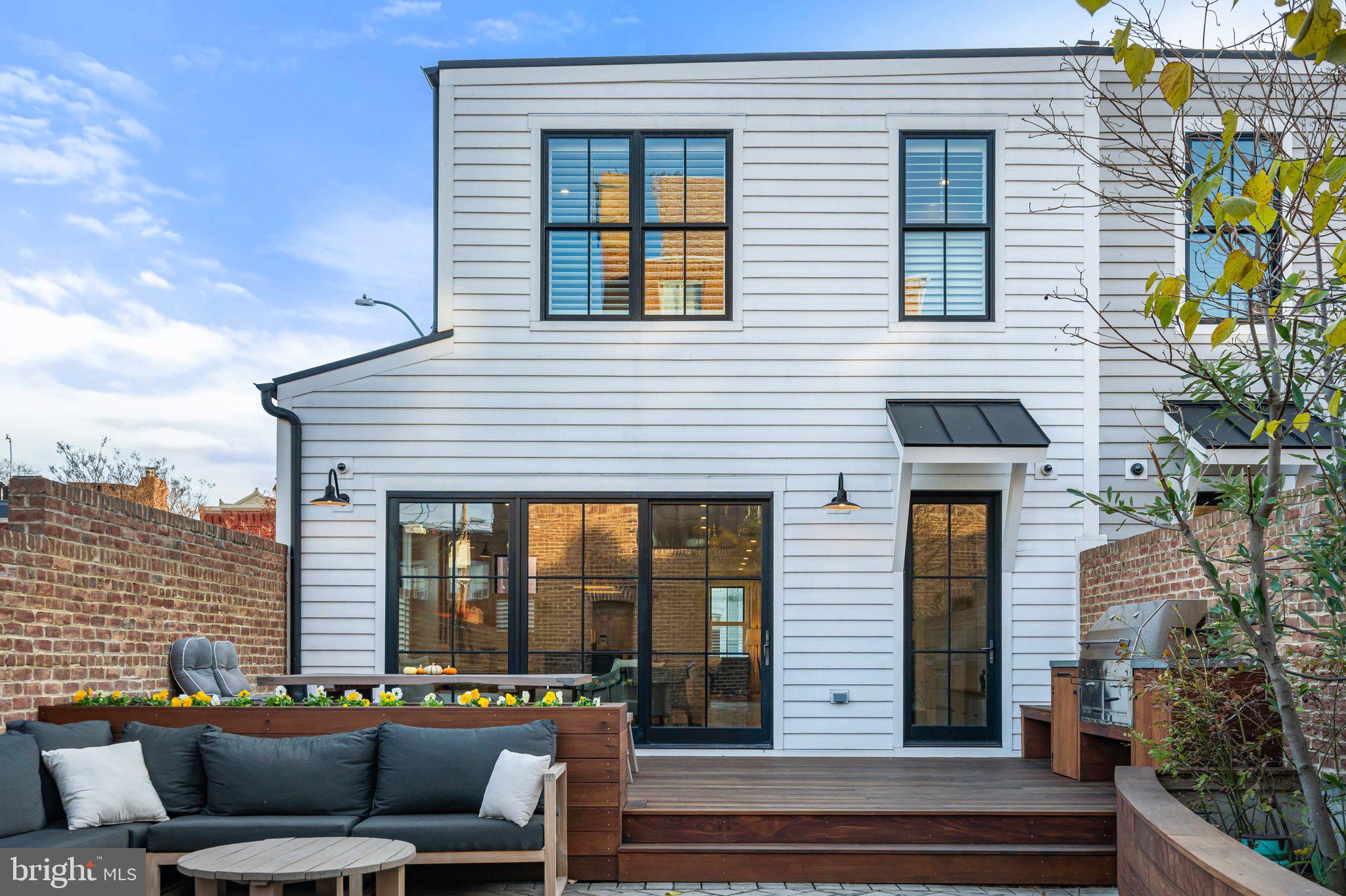 214 A Street Northeast Washington, DC 20002 - Photo 21 of 78 a view of a patio with couches chairs and potted plants