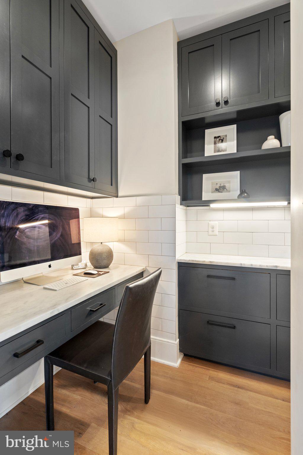 214 A Street Northeast Washington, DC 20002 - Photo 27 of 78 a kitchen with a sink cabinets and wooden floor