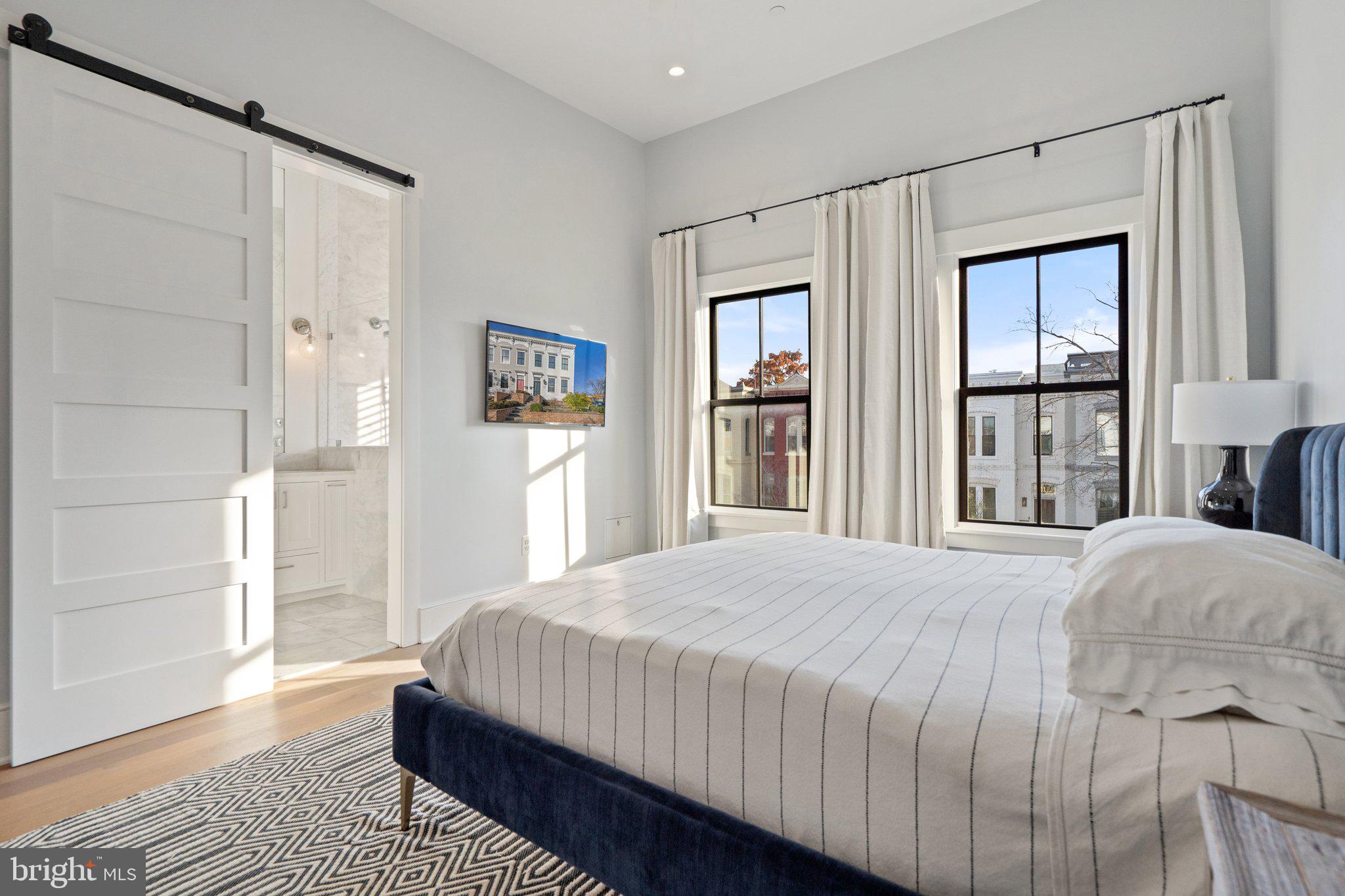 214 A Street Northeast Washington, DC 20002 - Photo 31 of 78 a bedroom with a bed wooden floor and window