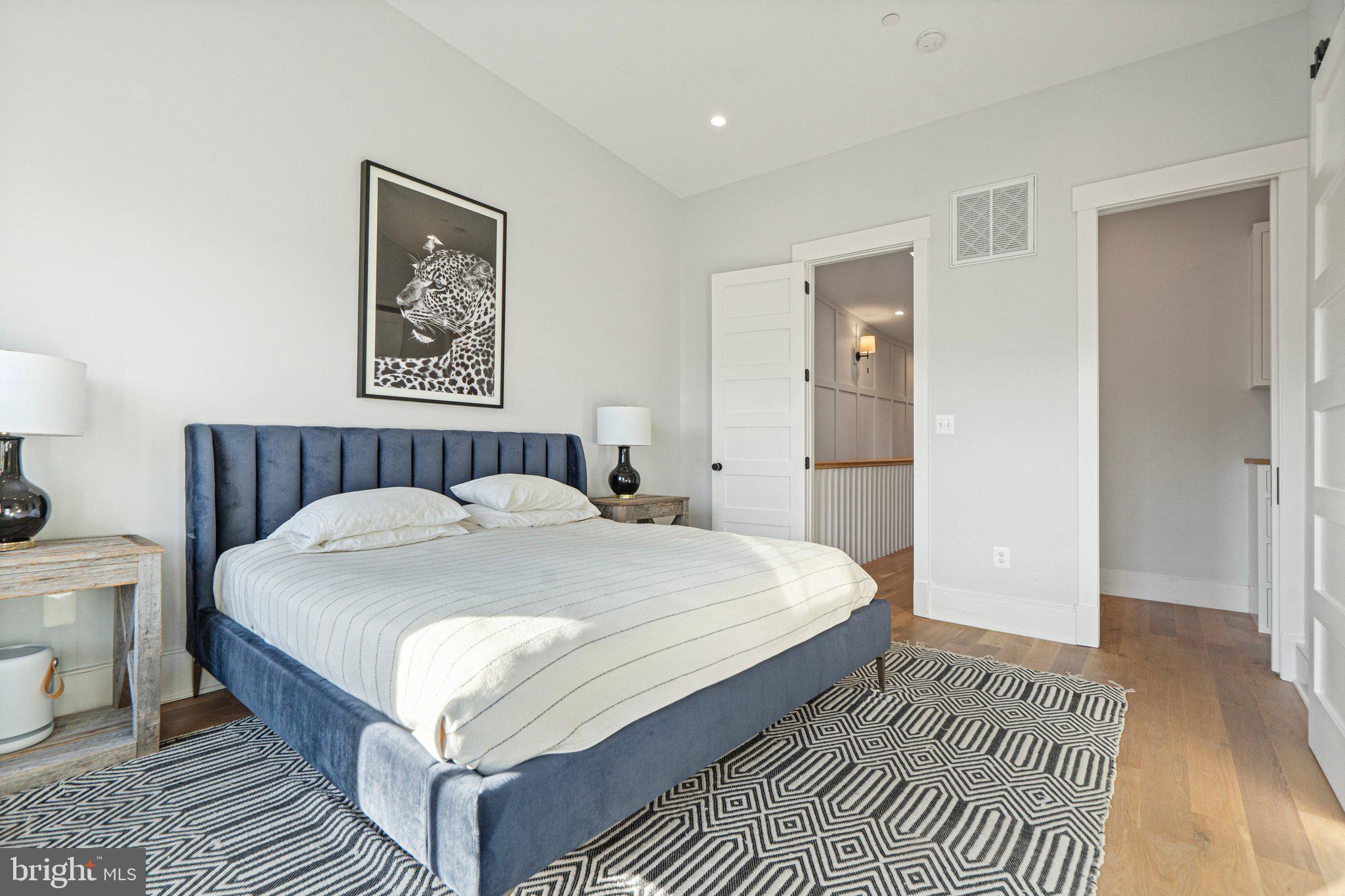 214 A Street Northeast Washington, DC 20002 - Photo 33 of 78 a large bed sitting in a bedroom and a table