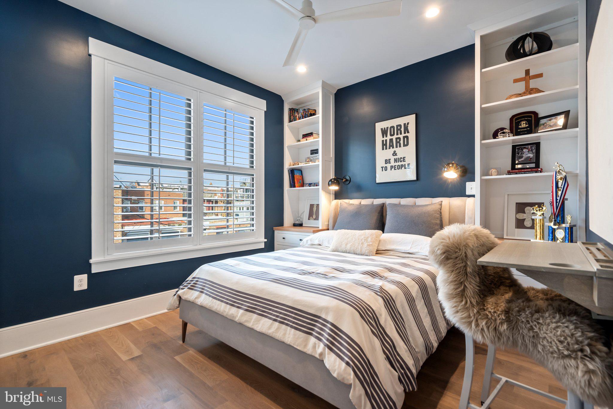 214 A Street Northeast Washington, DC 20002 - Photo 42 of 78 a bed sitting in a bedroom next to a window