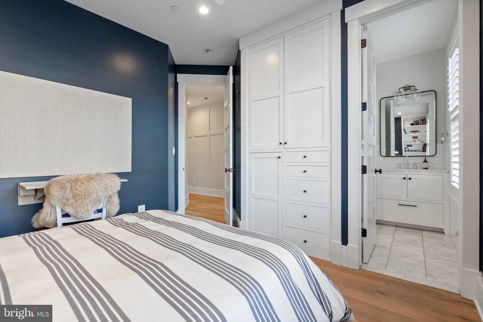 214 A Street Northeast Washington, DC 20002 - Photo 43 of 78 a bedroom with a bed and a mirror