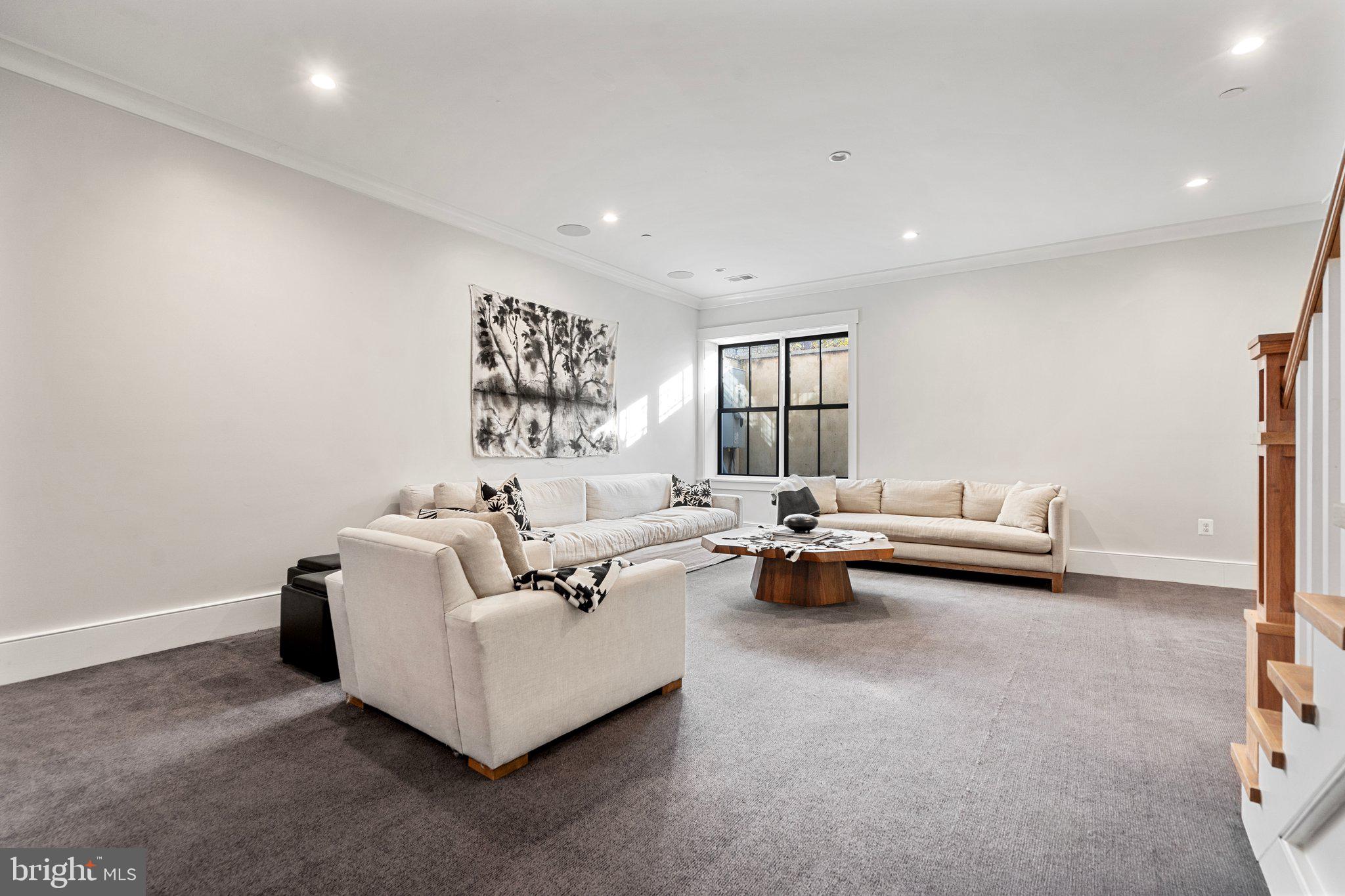 214 A Street Northeast Washington, DC 20002 - Photo 48 of 78 a living room with furniture and a table